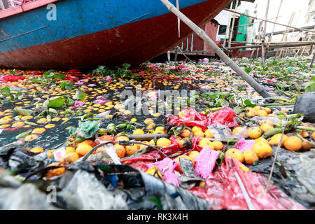 Dhaka, Bangladesh - February 09, 2019:  Industry, mills, factories, chemical waste, orange, plastic and garbage at the polluted Buriganga River in Dhaka, Bangladesh, Credit: SK Hasan Ali/Alamy Live News Stock Photo