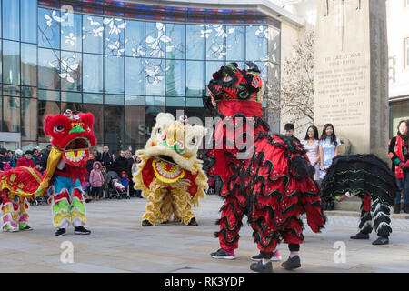 Woking, Surrey, UK. 9th February, 2019. Woking town centre celebrated the Chinese New Year of the Pig today with colourful parades and shows. The lion dance performance. Stock Photo