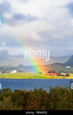 Rainbow above the coastal village of Leknes, Vestvagoy, Lofoten Islands, Norway Stock Photo