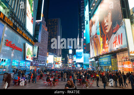 NEW YORK - CIRCA MARCH 2016: Times Square H&M store at night. H & M Hennes & Mauritz AB is a Swedish multinational retail-clothing company, known for  Stock Photo