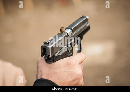 Close-up detail view of pistol, handgun, gun malfunctions. Clearance safety drills Stock Photo