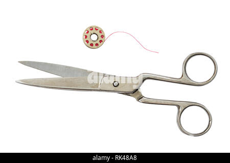 Set of old vintage scissors and a spool isolated on white Stock Photo