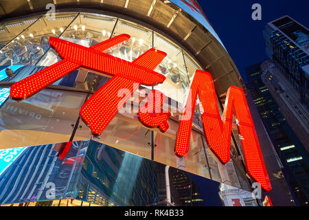 NEW YORK - CIRCA MARCH 2016: Times Square H&M store at night. H & M Hennes & Mauritz AB is a Swedish multinational retail-clothing company, known for  Stock Photo