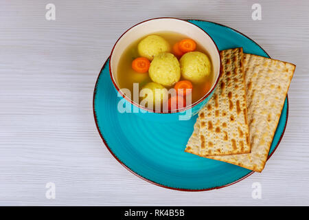 Jewish Holiday kosher food served on passover matzah ball soup in a pot Stock Photo