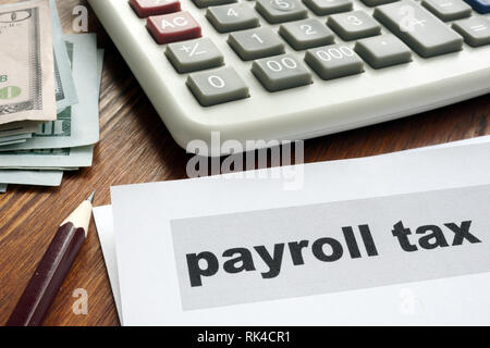 Payroll tax concept. Papers, calculator and money. Stock Photo