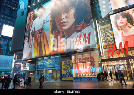 NEW YORK - CIRCA MARCH 2016: Times Square H&M store at night. H & M Hennes & Mauritz AB is a Swedish multinational retail-clothing company, known for  Stock Photo