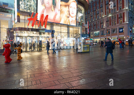 NEW YORK - CIRCA MARCH 2016: Times Square H&M store at night. H & M Hennes & Mauritz AB is a Swedish multinational retail-clothing company, known for  Stock Photo