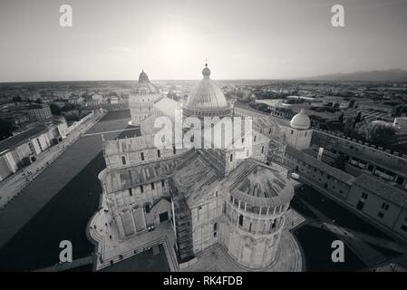 Cathedral viewed from top of Pisa leaning tower at sunset wide angle view Stock Photo