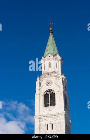 Bell Tower of the Catholic Parish Church in Cortina d' Ampezzo, called Basilica Minore dei Santi Filippo e Giacomo, in the Belluno region of Italy on  Stock Photo