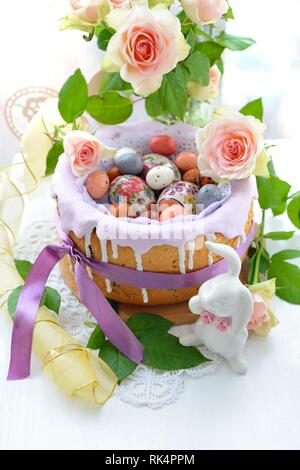 Easter cake with glace icing and easter eggs Stock Photo