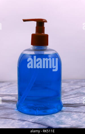 Dishwashing liquid detergent in plastic bottle isolated on white background. Green color dishwashing liquid . Stock Photo