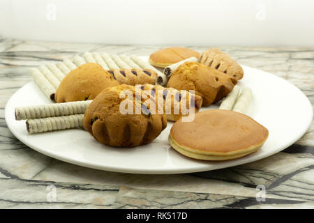 chocolate chips banana muffins on rustic background . Stock Photo