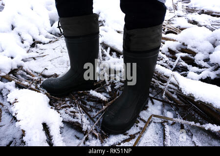 Pair of blue rubber EVA boots isolated on white . Stock Photo