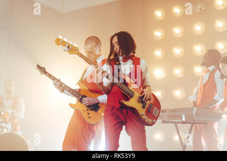two guitarists performing in a studio, close up photo. fantastic performance. show, event Stock Photo