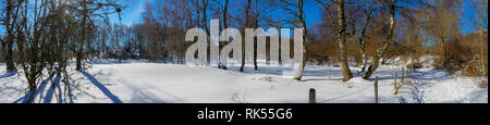 Panoramic shot of the campaign snowy in Auvergne. On the way to the Puy de Parioux, col ghouls, Puy-de-Dome, Auvergne Stock Photo