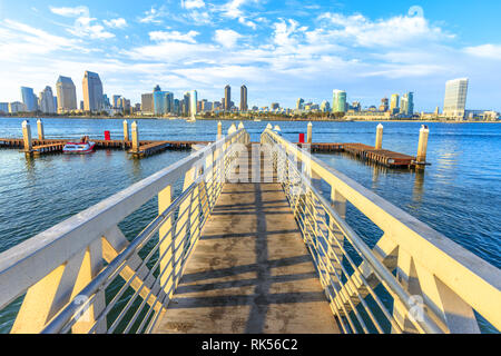 The view on San Diego Downtown skyline from the wooden pier with boardwalk on Coronado Island in San Diego Bay. Travel summer destination in Stock Photo