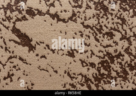 Mottled fabric texture with light brown surface. Stock Photo