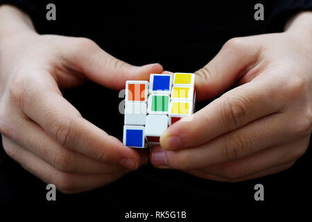 a person trying to equalize the colors of the intelligence cube, Stock Photo