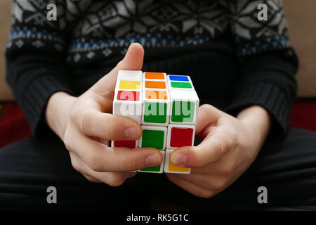 a person trying to equalize the colors of the intelligence cube, Stock Photo