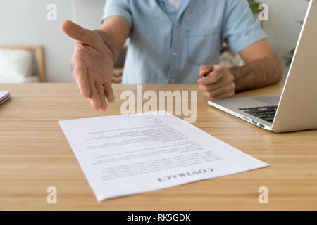 Salesman offering to sign this paper business contract concept Stock Photo