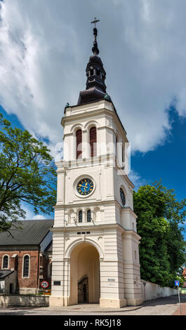 Neo-baroque bell tower at Collegiate Church  seen from Rynek , in thermal spa town of  Uniejow in Wielkopolska or Greater Poland region, Poland Stock Photo