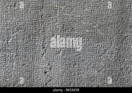 Texture gray painted uneven wall for the background of the inscriptions Stock Photo