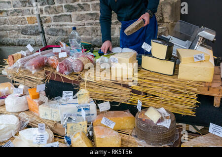 Artisan cheese stall, cheeses on display, Leith Saturday market, Dock Place, Edinburgh, Scotland, UK Stock Photo