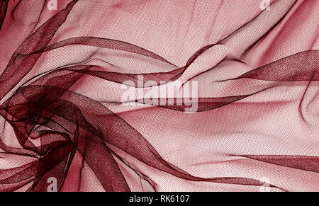 Red tulle background with drapery Stock Photo