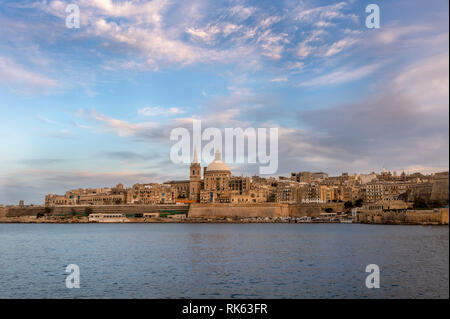 Valletta, capital city of Malta viewed across the harbour, early evening. Stock Photo