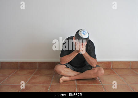 Portrait of a religious Jewish man with long ear locks outside of ...