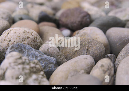 bunch of stones laying in the garden. winter day many different stones Stock Photo