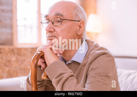 Portrait of upset man that being deep in thoughts Stock Photo