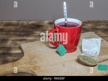 A cup of tea served on a table on a wooden board in a traditional way Stock Photo
