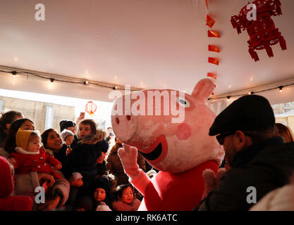 London, UK.  9th Feb, 2019. An actor dressed up as Peppa Pig is greeted by children during a Chinese New Year celebration at Duke of York Square in London, Britain, on Feb. 9, 2019. Credit: Han Yan/Xinhua/Alamy Live News Stock Photo