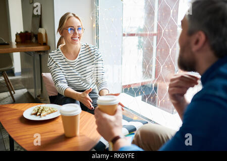 Discussion in cafe Stock Photo