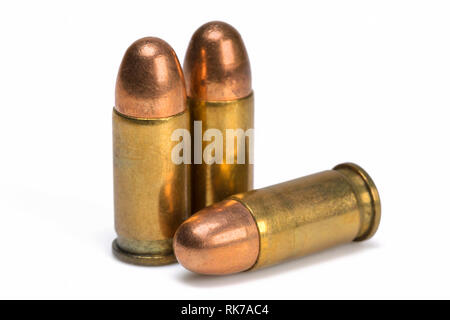 Three pistol bullets isolated on white background. Stock Photo