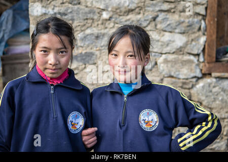 Young schoolgirls in the village of Laya, Gasa District, Snowman Trek, Bhutan Stock Photo