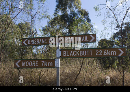 An information sign on the Brisbane Valley Rail Trail directing users towards the trail towns of Blackbutt and Moore. Stock Photo