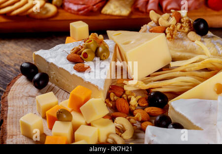 Composition with different sorts of cheese on wooden table Stock Photo