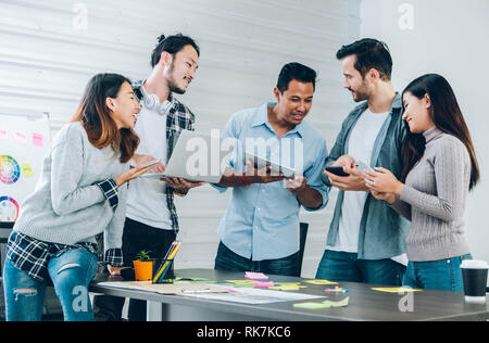 Diversity Designer in casual cloth using technology device at meeting table in meeting room at creative office Stock Photo