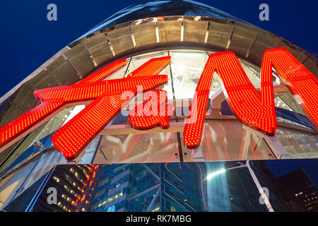 NEW YORK - CIRCA MARCH 2016: Times Square H&M store at night. H & M Hennes & Mauritz AB is a Swedish multinational retail-clothing company, known for  Stock Photo