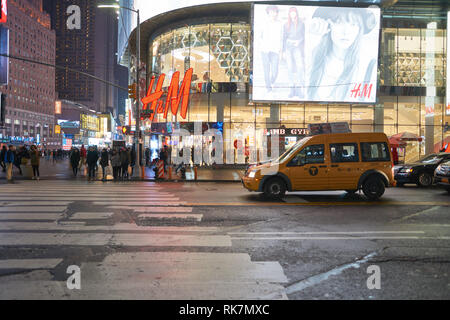 NEW YORK - CIRCA MARCH 2016: Times Square H&M store at night. H & M Hennes & Mauritz AB is a Swedish multinational retail-clothing company, known for  Stock Photo