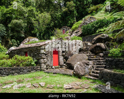 Image of old stone houses based on a hill landscape on the Azores Stock Photo