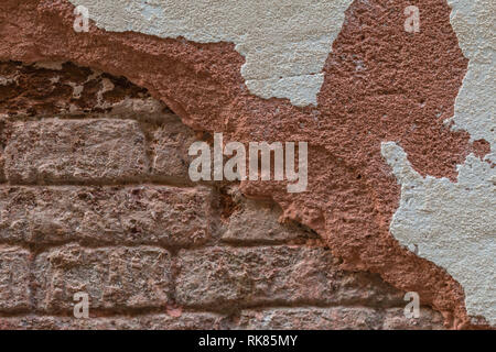 Brick Wall with Deteriorated Stucco Stock Photo