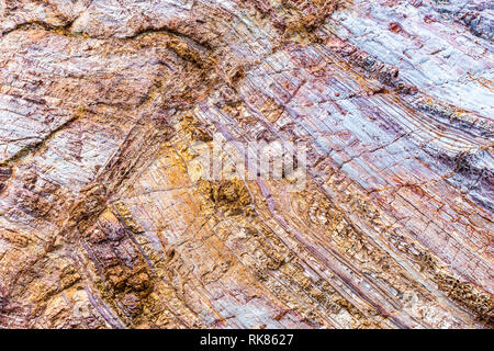 Rock layers - a colorful formations of rocks stacked over the hundreds of years. Interesting background with fascinating texture. Stock Photo