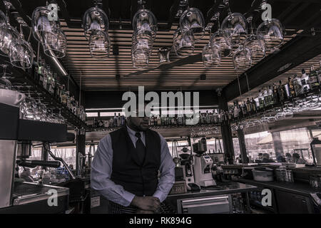 PALMA DE MALLORCA, SPAIN - FEBRUARY 9, 2019: Bartrender inside bar of restaurant Pesquero on February 9, 2019 in Palma de Mallorca, Spain. Stock Photo