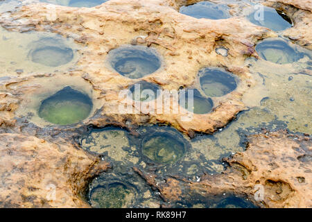 Ocean Erosion Pot hole at Yehliu Geopark in Taiwan Stock Photo