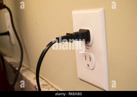 Appliances are plugged into kitchen outlets Stock Photo