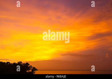 Orange sunset over Darwin Harbour in Darwin, Northern Territory, Australia. Stock Photo