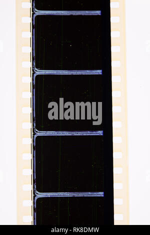 Extreme close up of 35mm movie film strip with black empty frames Stock Photo